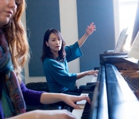 young kim teaching student piano